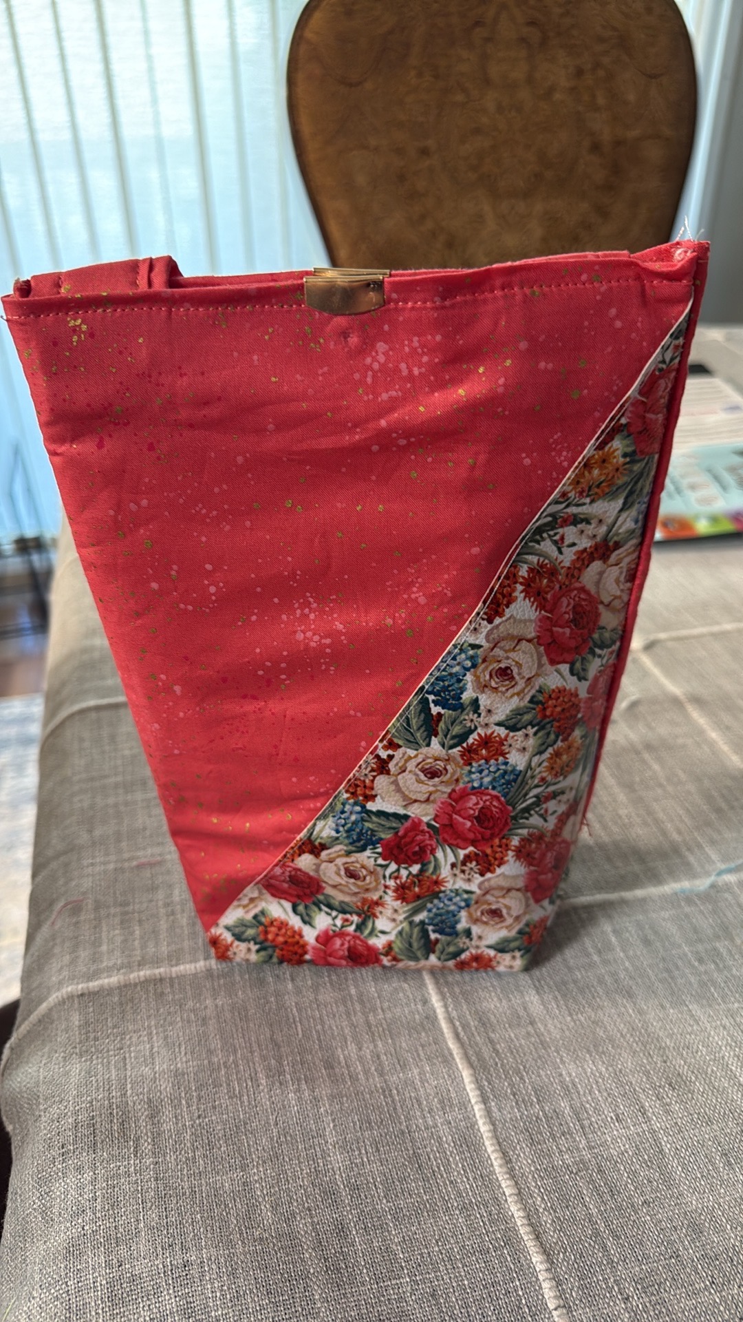 Coral clutch with diagonal floral panel and gold clasp